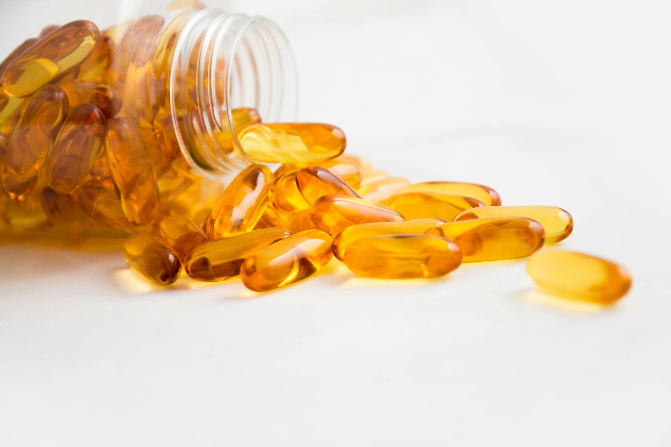 capsules coming out of a bottle